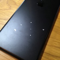 Matte black iPhone with chipped coating