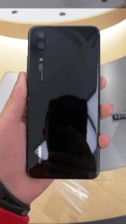 Huawei P20 dummy next to the P20 Lite (left), on its own showcasing the rear (right)