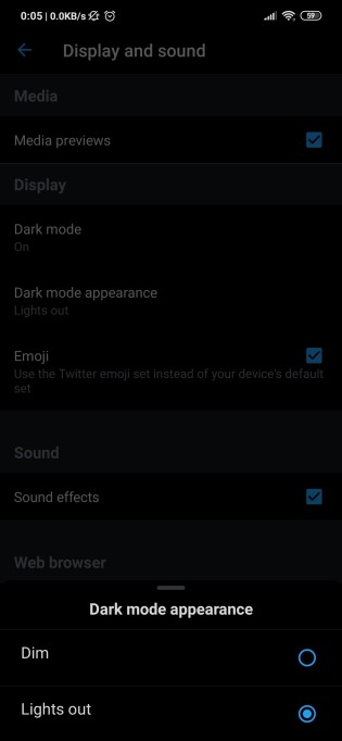 The option to enable Lights out is tucked inside 'Dark mode appearance'