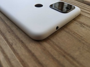 3.5mm headphone jack on top and fingerprint reader on the back