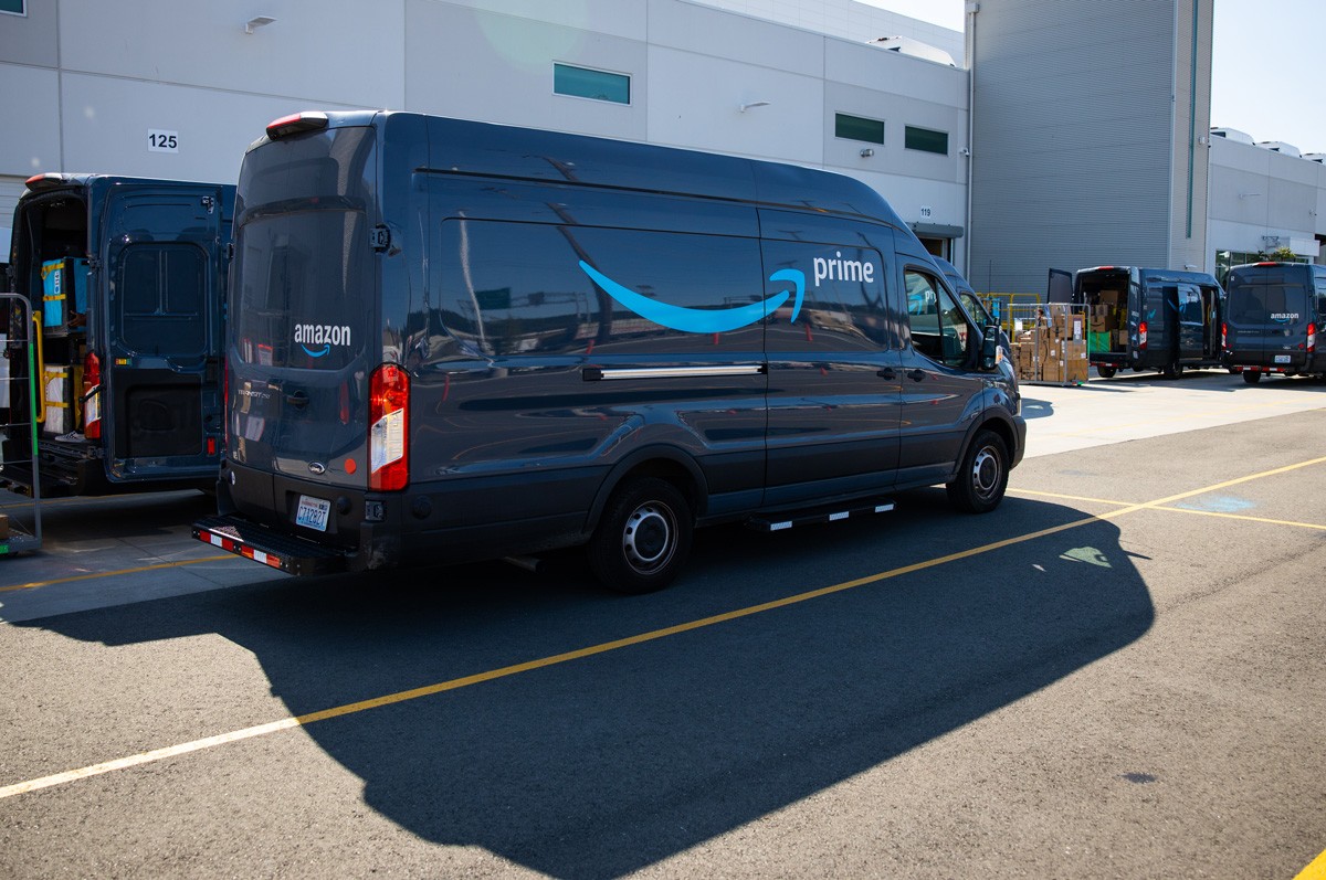 Amazon's delivery trucks being loaded