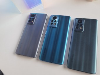 Three units of the upcoming Infinix phone showing off different colorways