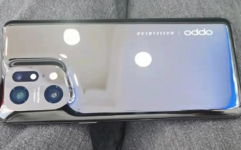 Oppo Find X5 Pro poses for the camera with reflective back