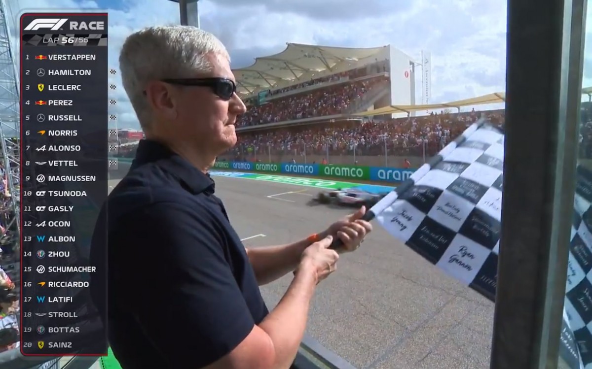 Tim Cook waving the checkered flag at the US Grand Prix in Austin, Texas 2022