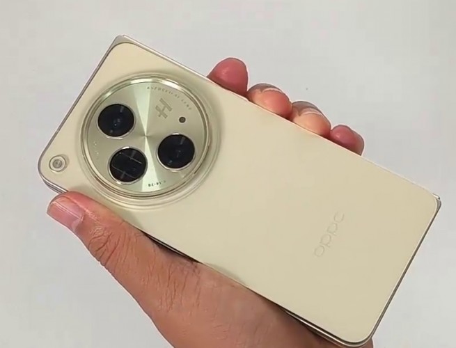Oppo Find N3 gold model poses for the camera ahead of launch