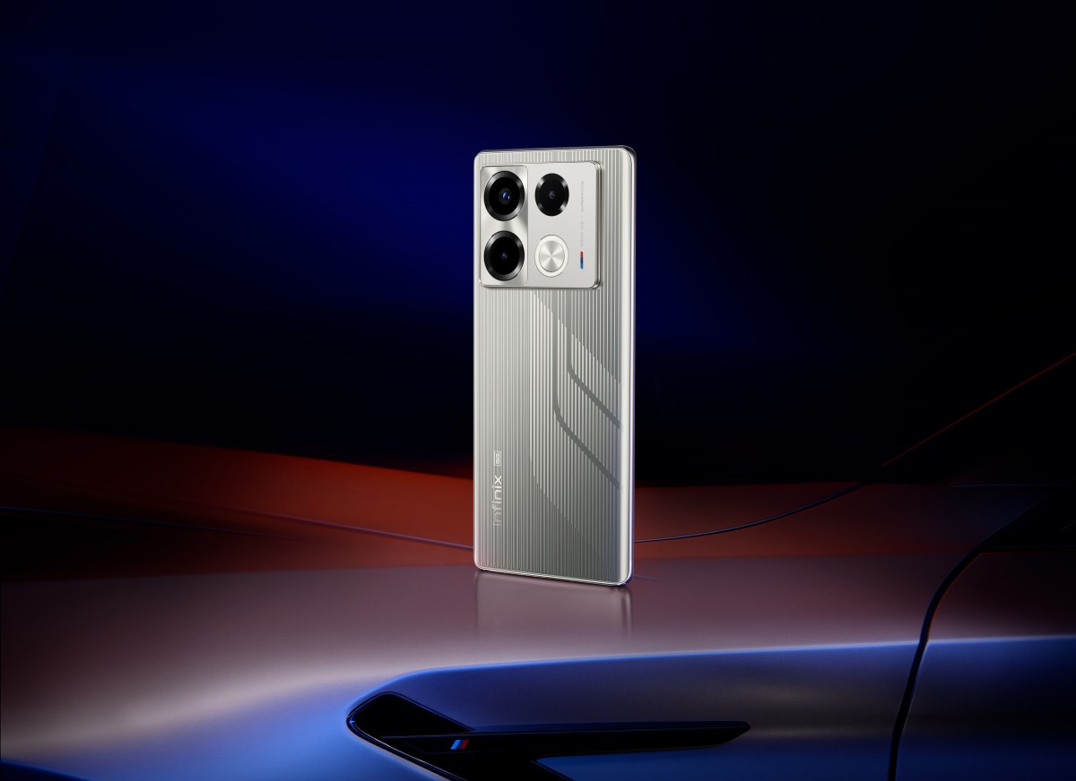  A render of the Infinix Note 40 Series Racing Edition BMW Designworks smartphone, which has a silver body with blue and red accents and a triple camera setup on the back.