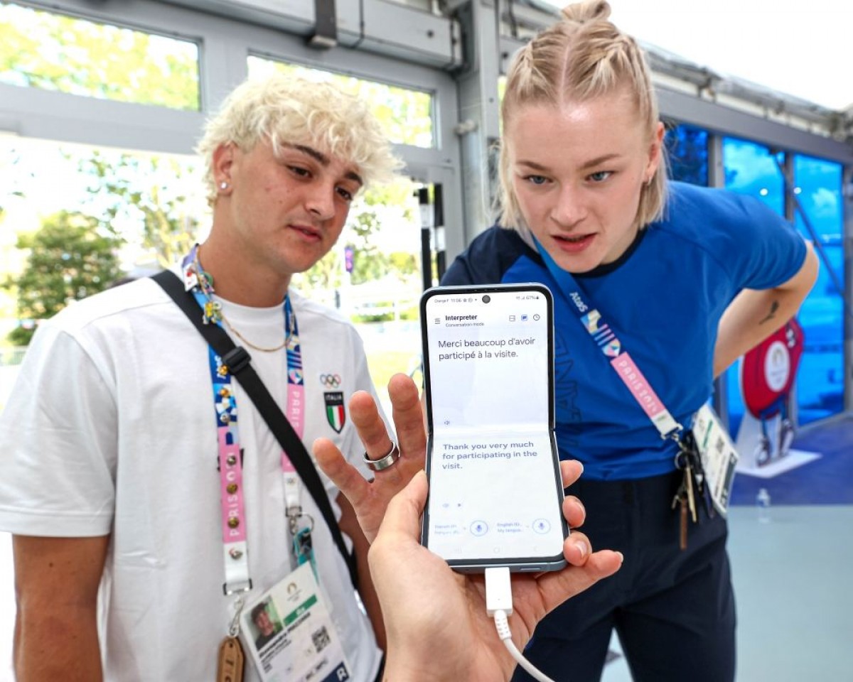 Team Samsung Galaxy members Alessandro Mazzara of Team Italy and Wilma Anna Helena Murto of Team Finland test out Interpreter on Samsung Galaxy Z Flip6