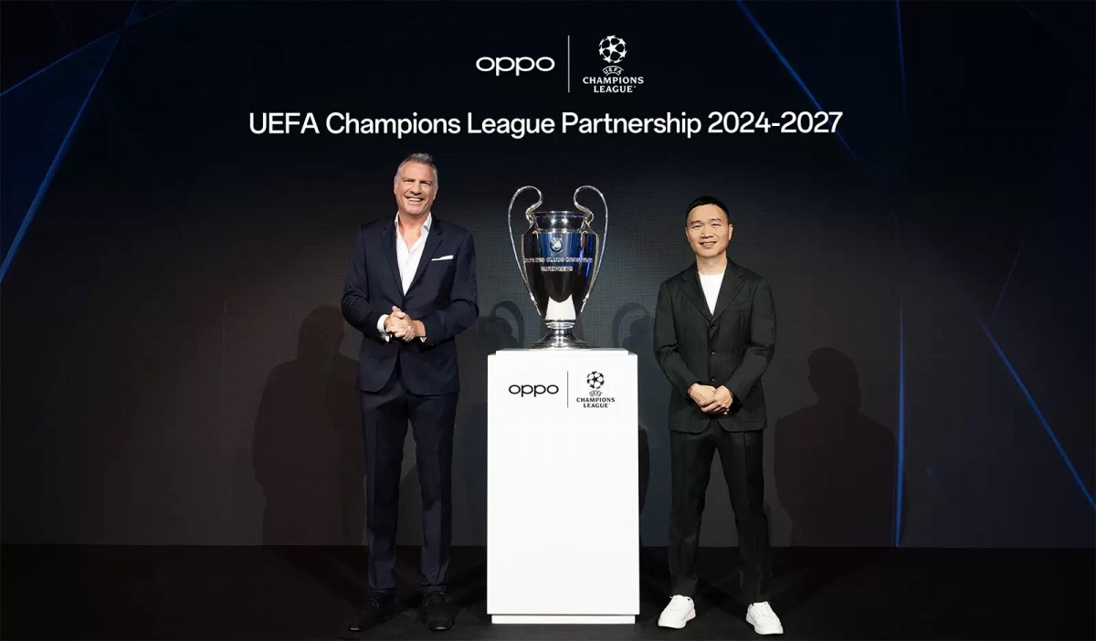 Group photo of Oppo and UEFA representatives