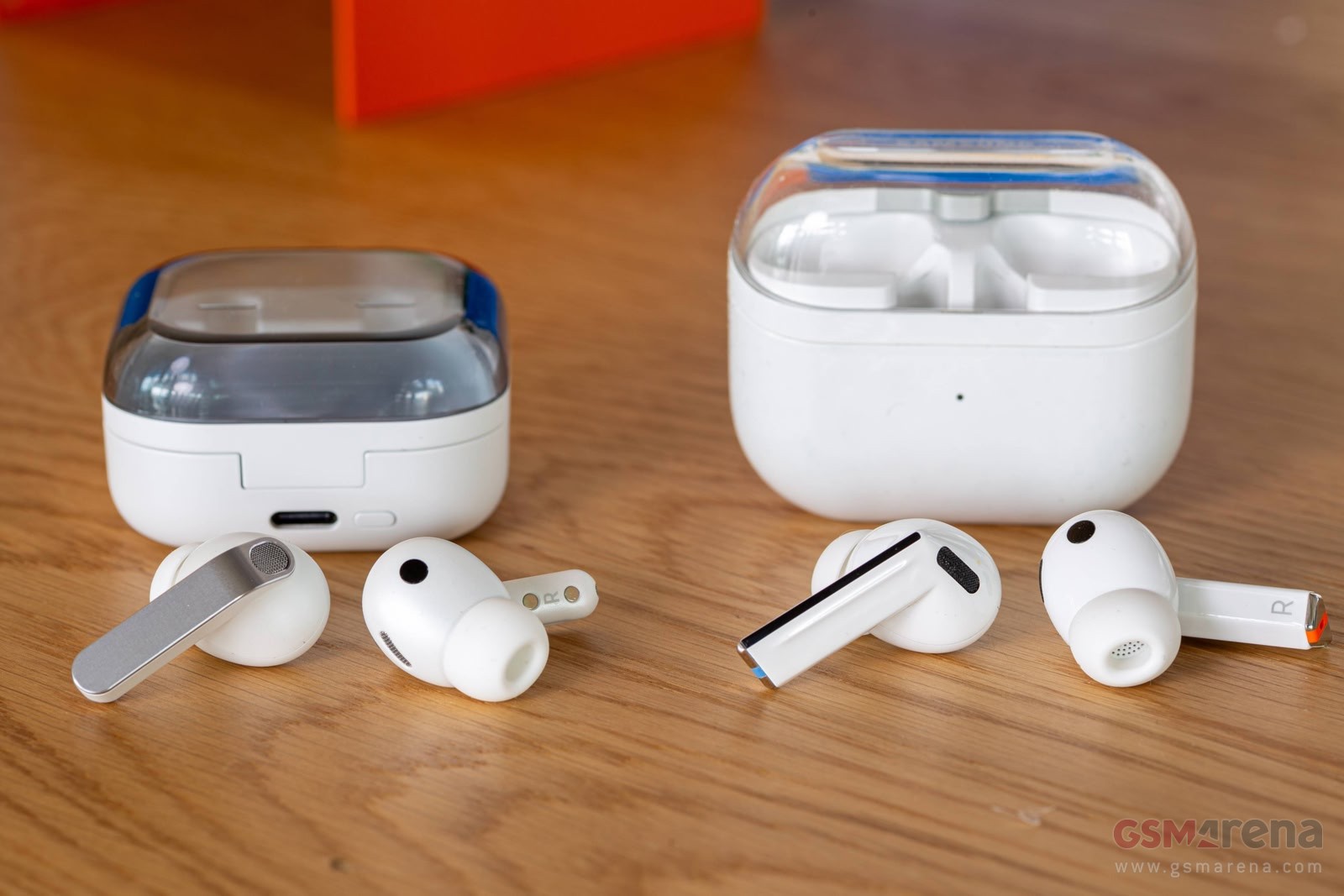 Samsung Galaxy Buds4 Pro and case (left) and Buds3 Pro and case (right)