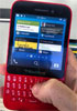 BlackBerry R10 poses for the camera in red and white